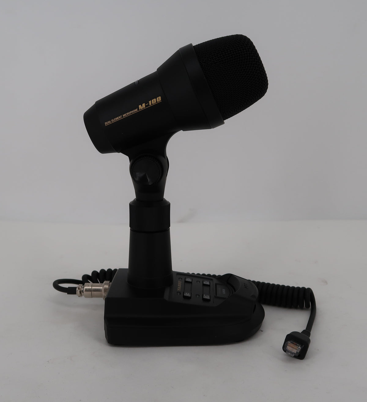 Yaesu M-100 microphone assembled on desktop stand with coiled cable