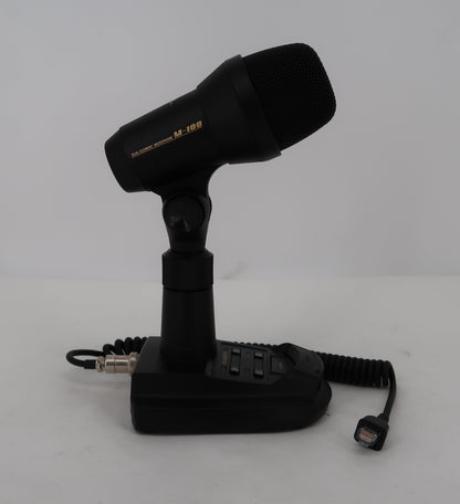 Yaesu M-100 microphone assembled on desktop stand with coiled cable